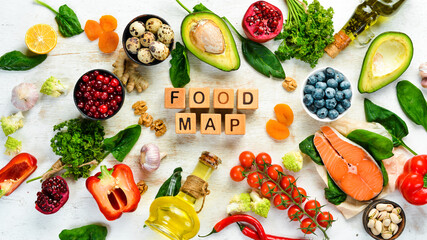 Food background. Food map: vegetables, fruits, fish, meat, nuts and other foods. Top view. Free copy space.