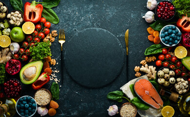 Obraz na płótnie Canvas Healthy food for the heart. Dietary food. On a black stone background. Top view. Free copy space.