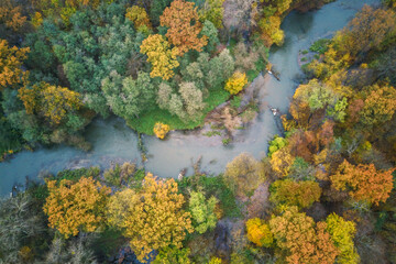 Naklejka na ściany i meble Aerial photography of the river and autumn forest, autumn landscape