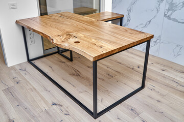 Live edge elm desk with metal base in a modern home office
