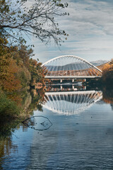 white bridge reflections over the romantic river at autumn 1