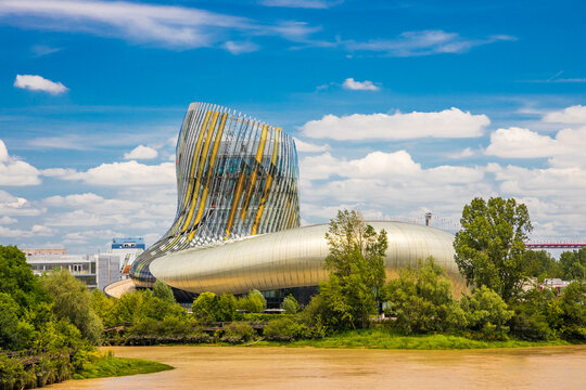 Cite du Vin Museum of wine in Bordeaux France, wide shot on a beautiful sunny day with a view of the Garonne River