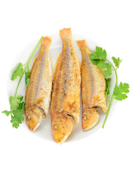 Three fried fish on the plate.