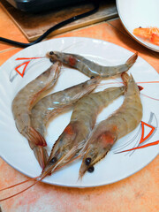 Fine selection of crustacean for dinner. Lobster, crab and jumbo shrimp on dark background