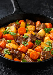Beef Stew with carrot and baby potato in iron cast pan