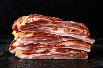 Stripy cured pork side bacon pancetta smoked on wood chip