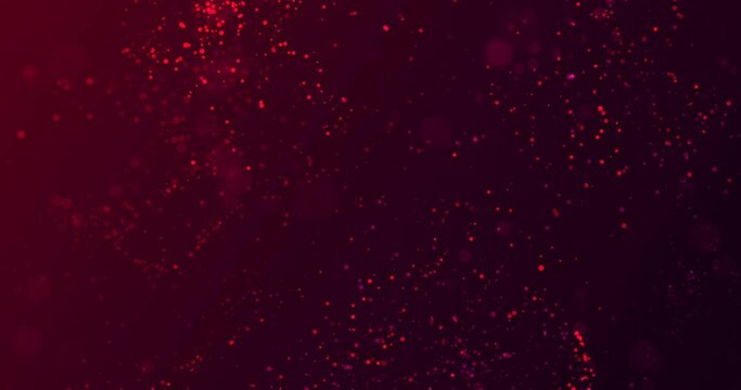 Red, magenta translucent particles with bokeh effect flicker and fly smoothly, chaotically on a gradient burgundy background
