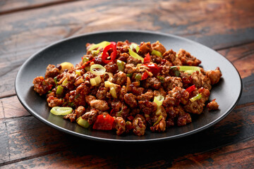 Chilli beef mince, ready to eat in black plate.