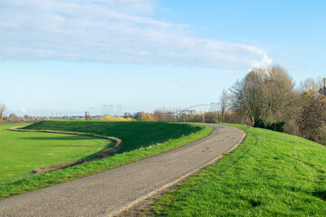 Fototapeta na wymiar Dutch landscape with dike and road