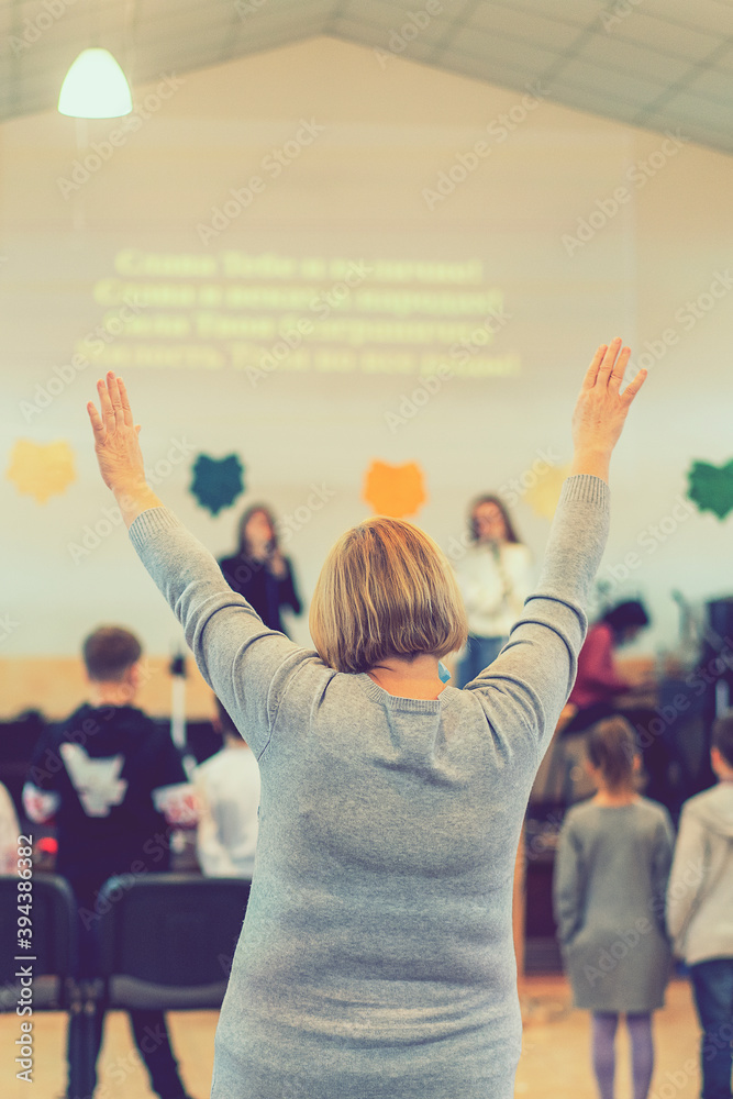 Wall mural people praying in a church. soft focus of christian people group raise hands up worship god jesus ch