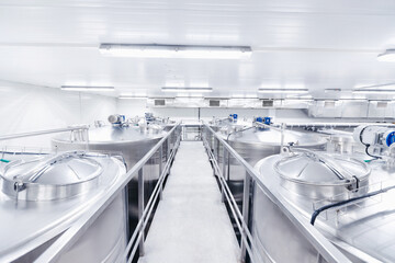 Equipment dairy plant, milk factory industry. Stainless steel storage and processing tanks