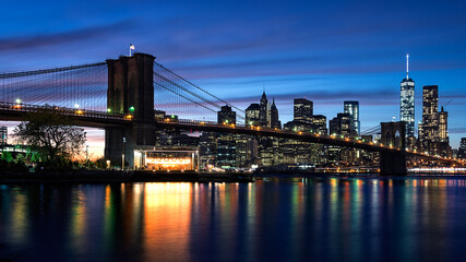 Naklejka na ściany i meble A landscape view of the Brooklyn Bridge as well as New York City.