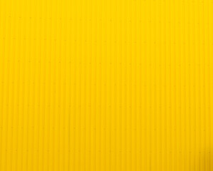 Yellow corrugated metal wall texture and background