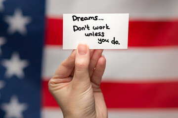 Dreams don't work unless you do text on a card. American flag background.