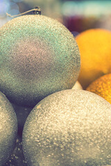 Golden Christmas balls, Christmas toys. Christmas tree decoration toys. Christmas concept. toned. vertical photo