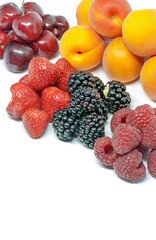 assorted piles of forest fruits on white