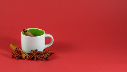 image of empty coffee and tea cup, cinnamon and anise close-up