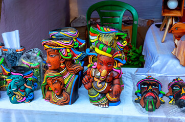 Fototapeta na wymiar Colorful traditional lord Ganesha and other sculpture style vase.