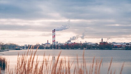 Pipes of CHP near the Kaban lake in Kazan.. Winter cityscape