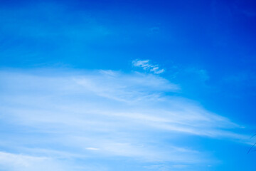Naklejka na ściany i meble White clouds on blue sky with copy space for banner or wallpaper background. freedom concept