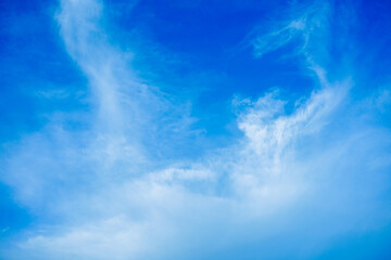 Naklejka na ściany i meble Wallpaper of White clouds on blue sky with copy space for banner background