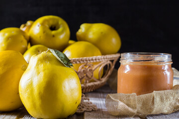 Quince on wooden background. Selective focus.