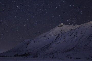 Norwegian mountains, snow, stars, night