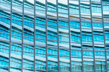 underside panoramic and perspective view to steel blue glass high rise building skyscrapers, business concept of successful industrial architecture