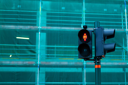 Traffic Light Of A Pedestrian Crossing With A Red Man Prohibiting Passage