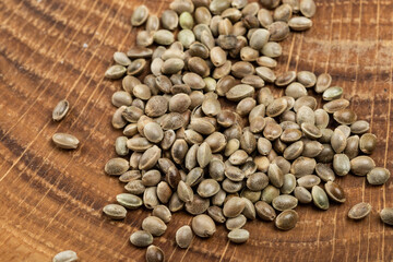 close up hemp seeds jon wooden board