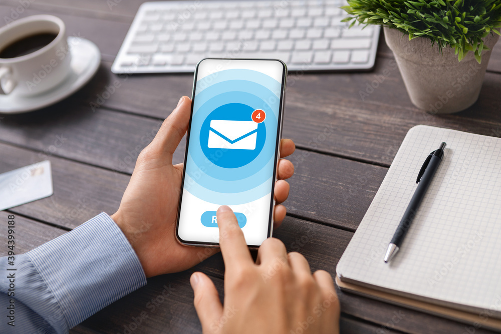 Poster collage with businessman opening unread messages in mobile email application at office desk, close u