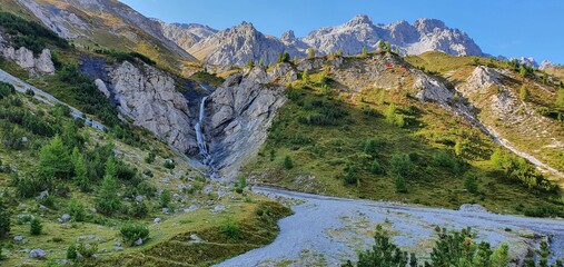 The gravel road trekking path in the italien alps, summer 2020