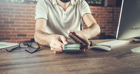  man hand holding wallet