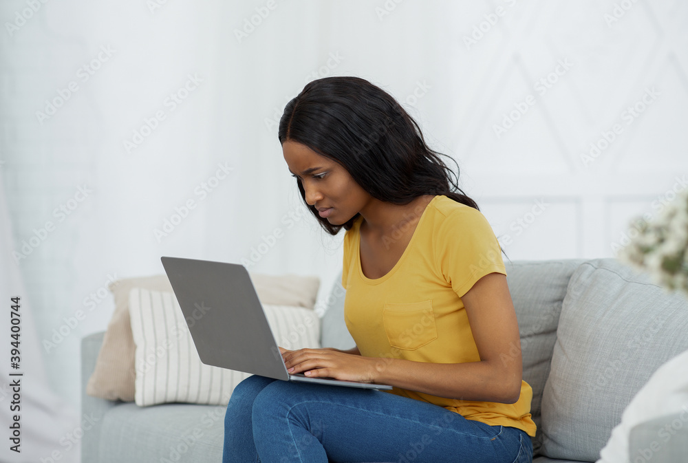 Canvas Prints pensive black student having difficulty passing exam or making online task on laptop at home