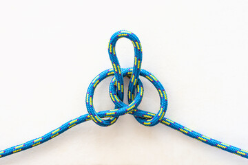Alpine butterfly knot on a white background 1/3