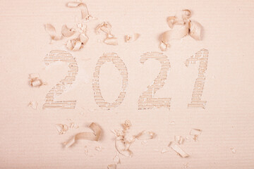 Decorated new year number 2021 is cut out of corrugated cardboard