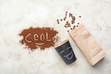 Composition with cup, bag, coffee beans and powder on light background