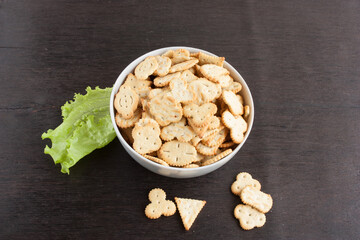 delicious dry cookies, biscuits, crackers with salt and herbs in a clay bowl