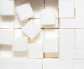 Sugar diced background close-up, white texture. diet