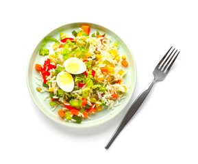 Plate of delicious rice salad with vegetables on light background