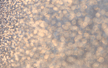 Christmas glittering Golden Background. Christmas lights. Blurred Xmas Bokeh as a Greeting card