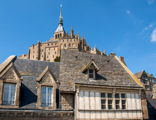 Fototapeta na wymiar Ancient buildings of the old town on the famous Mont Saint Michel island in France