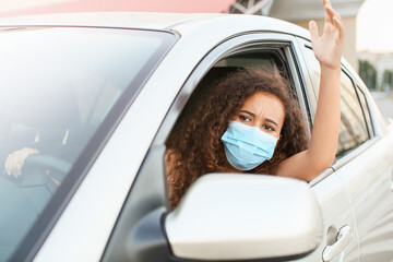 Stressed African-American female driver in car during traffic jam