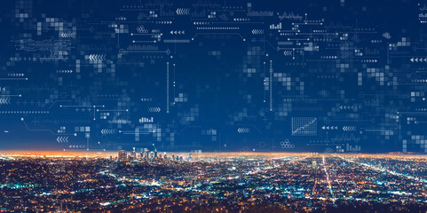 Technology screen with downtown Los Angeles at night - Powered by Adobe