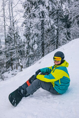 man strap in snowboard. winter sport activities