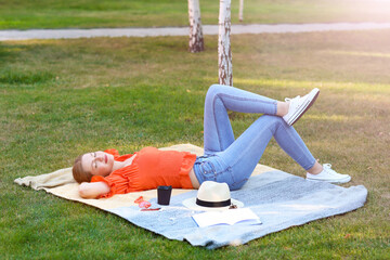 Beautiful young woman relaxing in park