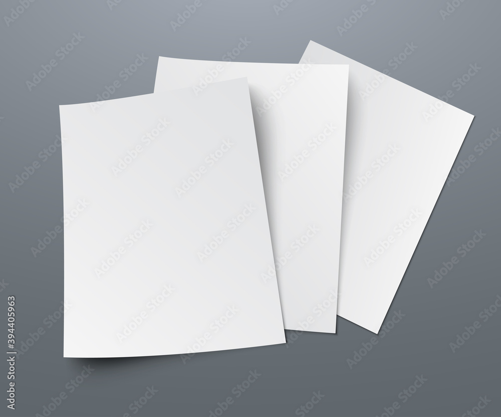 Poster three blanks of paper with shadows lie on a gray background. a4 paper page, mockup, sheet on the tab