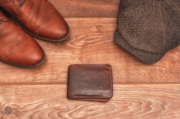 Men's clothing and accessories on a wooden background in warm colors