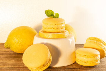 yellow french macaron on a lemon slice