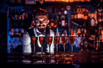 Barman mixes a cocktail on the beerhouse